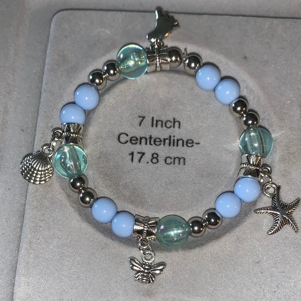Blue iridescent and silver stretch bracelet with beach charms